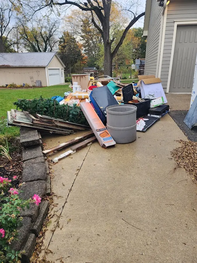 Dumpster being loaded with debris for 30 Yard Dumpster Rental in Woodbridge